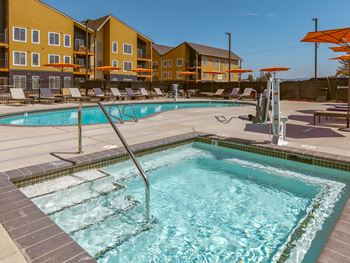 Swimming pool with hot tub